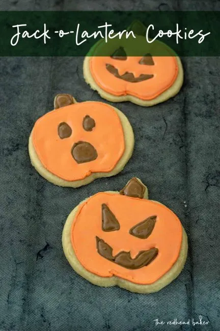 Three jack-o-lantern cookies