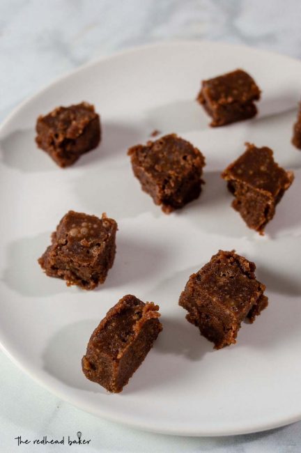 Squares of old-fashioned chocolate fudge on a plate