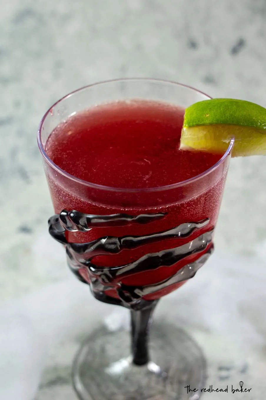 A close-up of a glass of pomegranate margarita