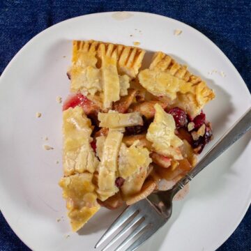 A slice of cranberry apple pie