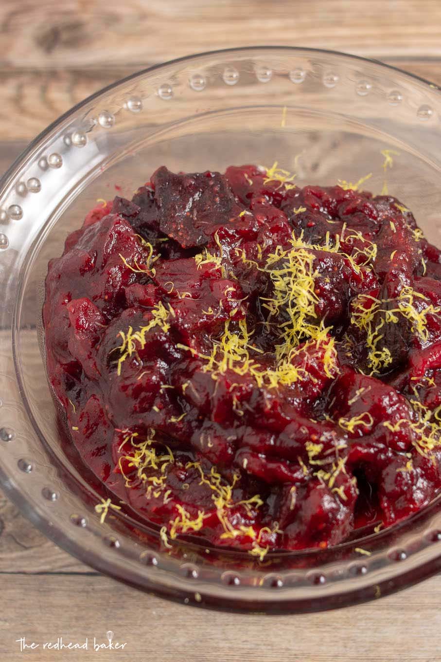 An overhead shot of cranberry-fig sauce garnished with lemon zest