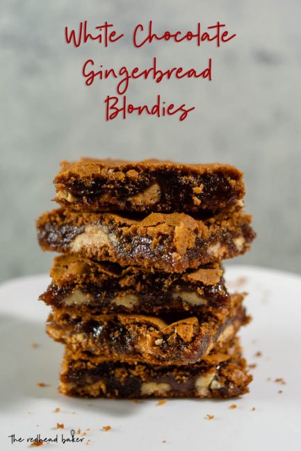Five gingerbread white chocolate blondies stacked on top of each other