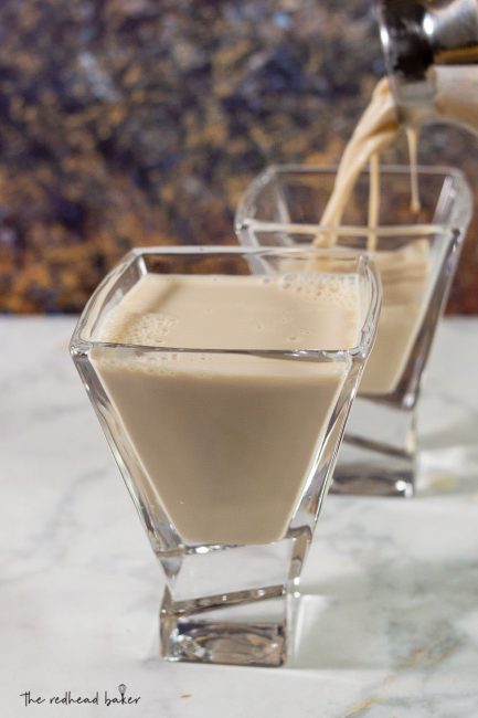 Sugar cookie martini being poured into Joy Jolt martini glasses