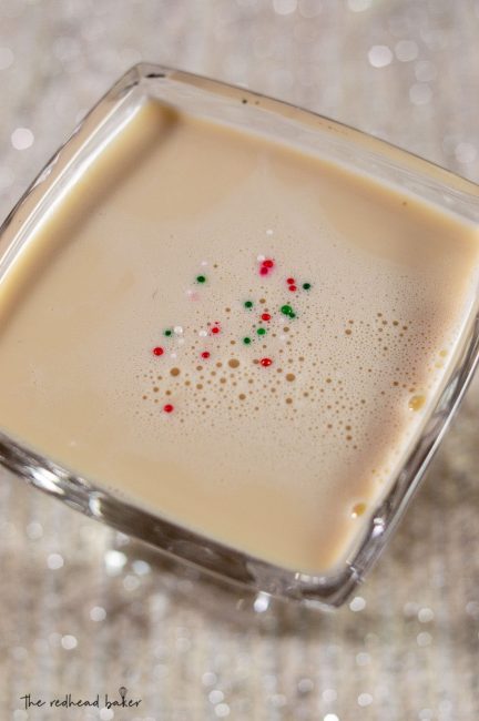 A sugar cookie martini with sprinkle garnish