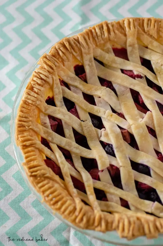 A baked rhubarb berry pie with a lattice crust.