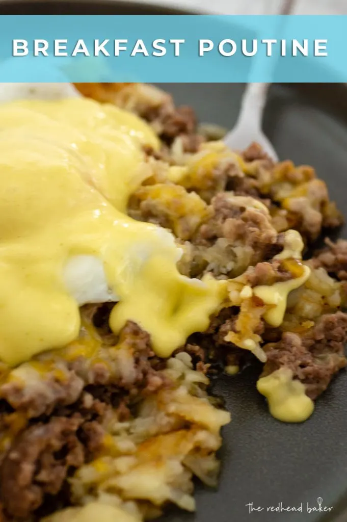 A close up of a plate of breakfast poutine with a fried egg and Hollandaise