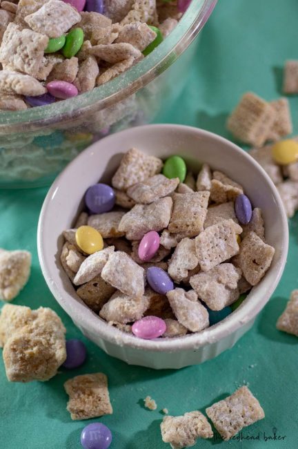 A ramekin of Easter muddy buddies (aka Bunny Bait) next to a larger bowlful