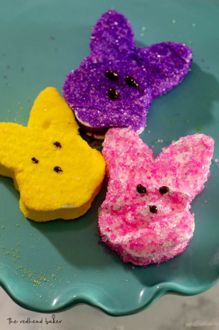 One yellow, one purple and one pink marshmallow bunny