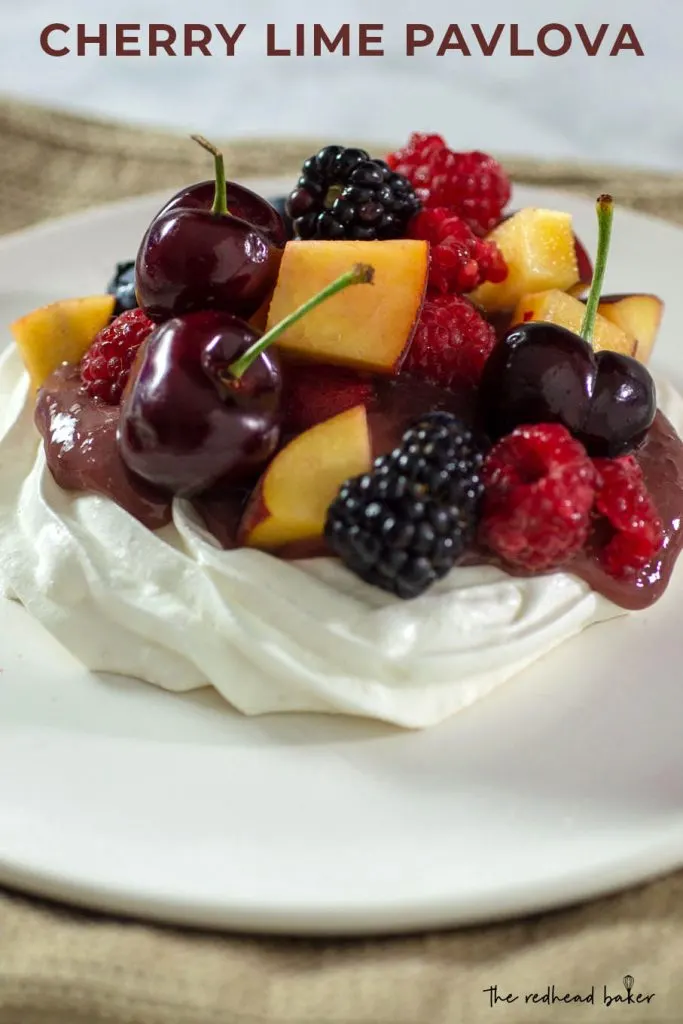 A cherry-lime pavlova on a white plate