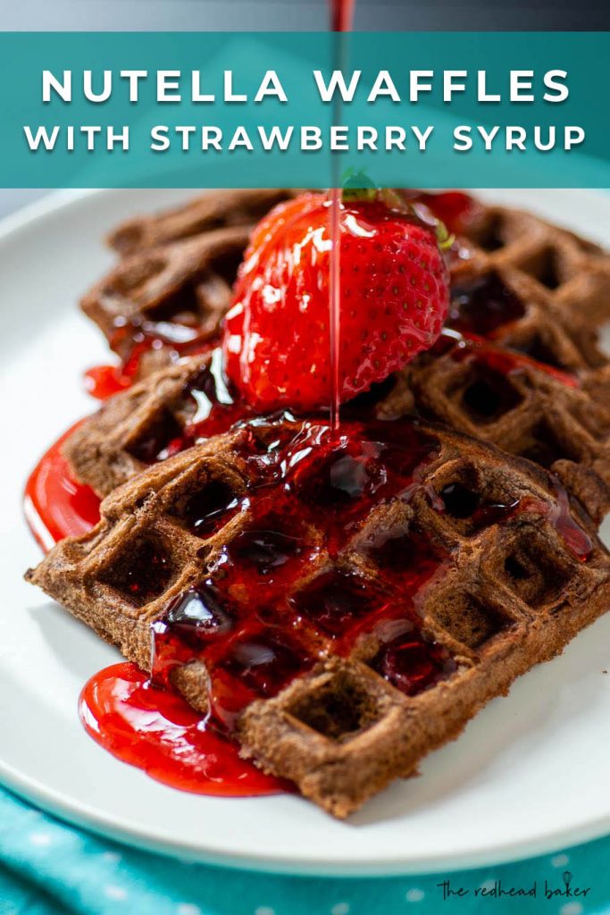 Nutella waffle wedges topped with a fanned strawberry and strawberry syrup