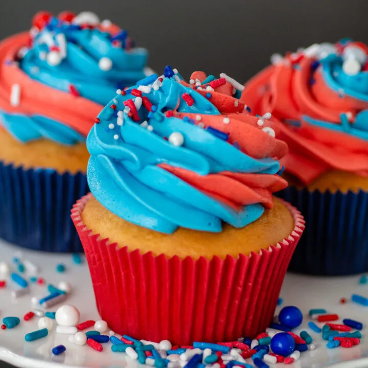 Three cupcakes with swirled icing.