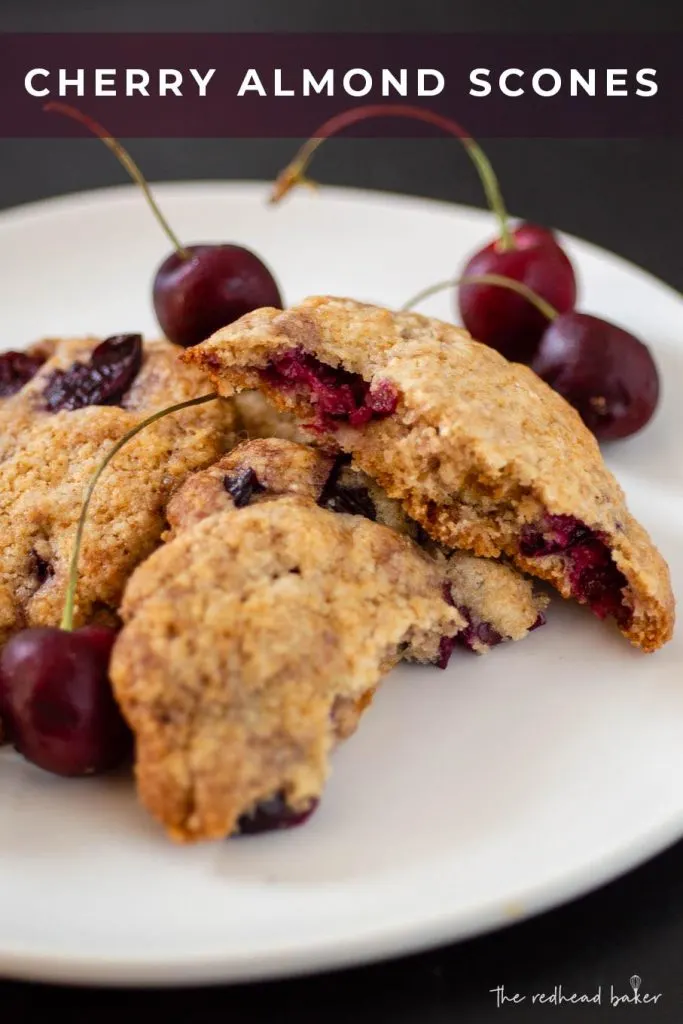 Cherry almond scones and fresh cherries on a plate