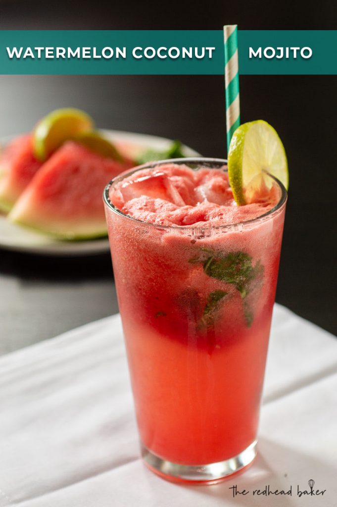 A glass of watermelon coconut mojito garnished with a lime slice