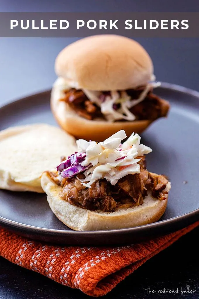 Two pulled pork sliders on a plate