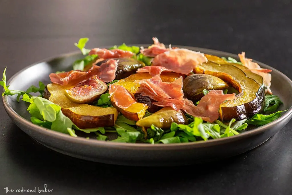 A plate of roasted acorn squash and fig salad