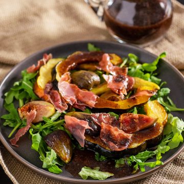 Acorn Squash and Fig Salad on a black plate