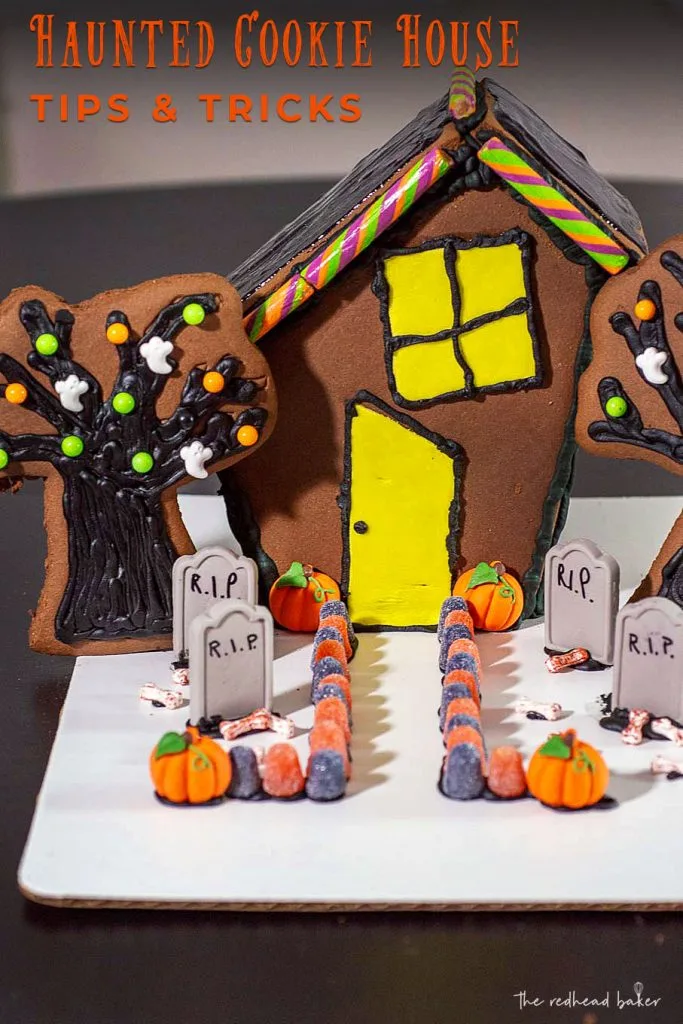 Wilton makes it easy to create a spooky haunted Halloween cookie house with kits, which includes pre-made cookie house pieces, trees, and candy decorations. You can also incorporate other Wilton products! #HalloweenTreatsWeek