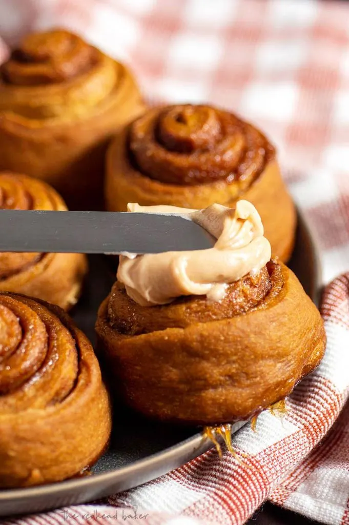 Gingerbread cinnamon rolls are very similar to traditional cinnamon rolls, but the dough is flavored with ginger, cloves, and cinnamon. The final rise occurs overnight, so they can be baked first thing in the morning!