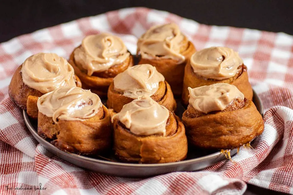 A plateful of iced gingerbread cinnamon rolls