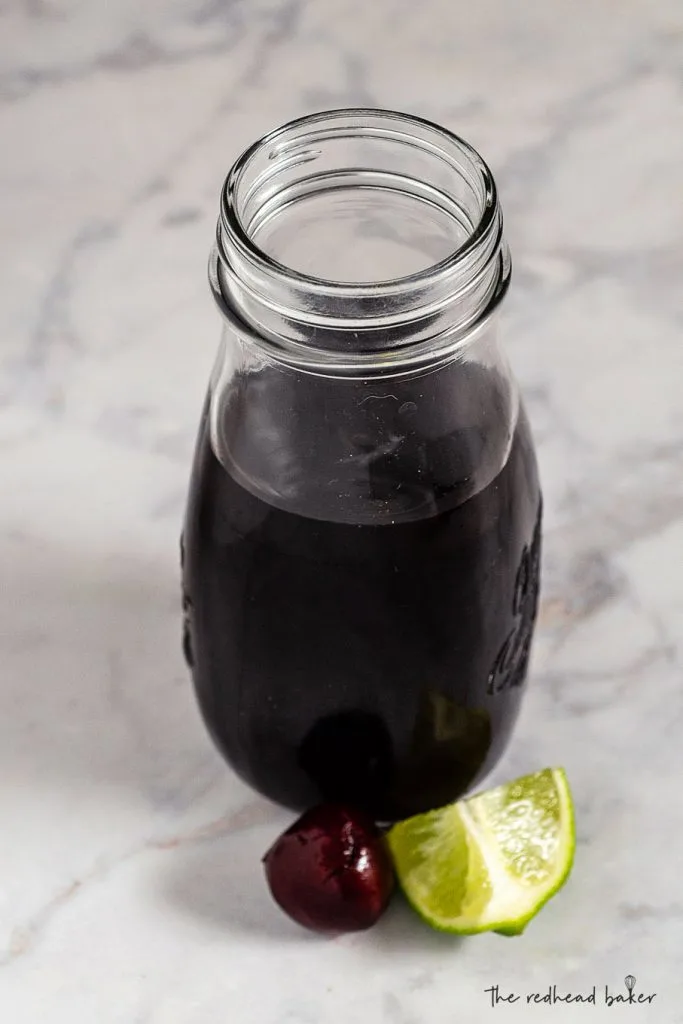 A bottle of homemade cherry limeade