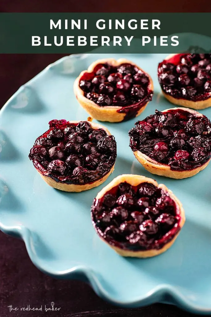 A serving plate with five mini ginger blueberry pies