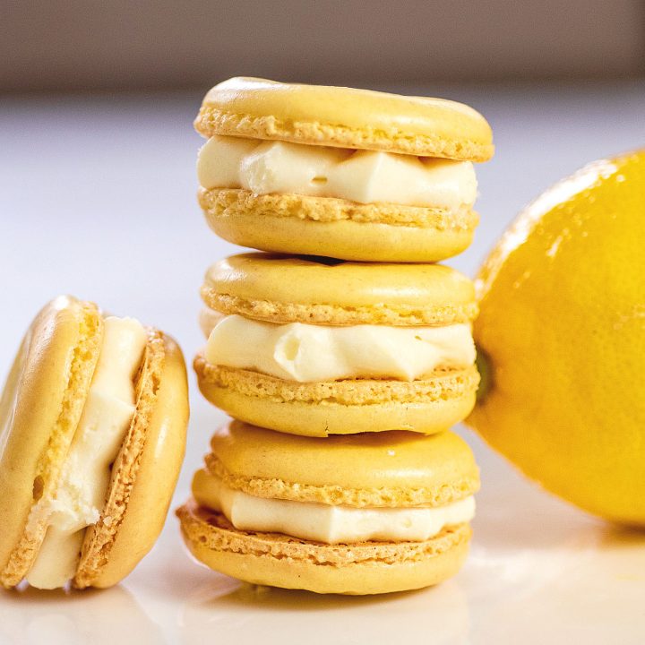 A stack of three lemon macarons