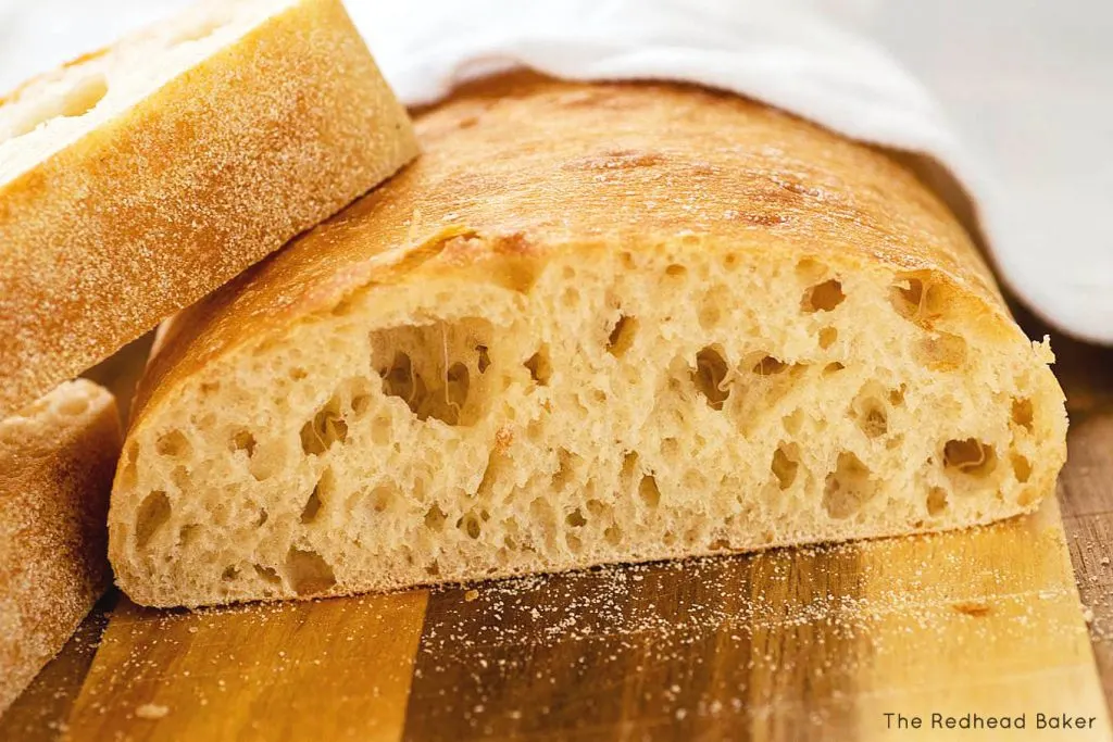 A loaf of ciabatta with slices cut off