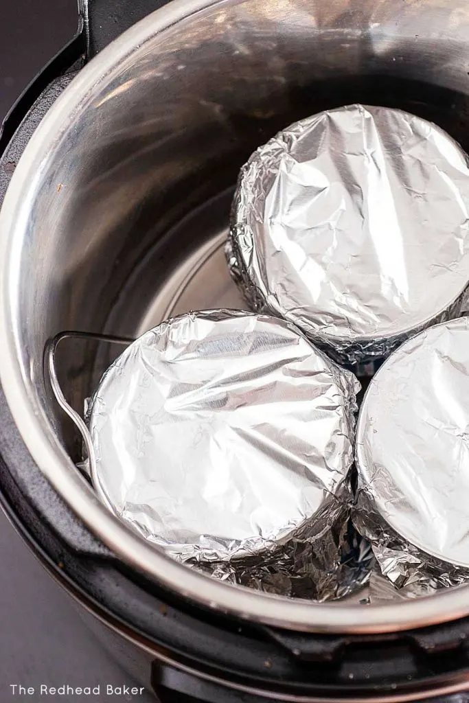 Three ramekins of chocolate custard inside an Instant Pot