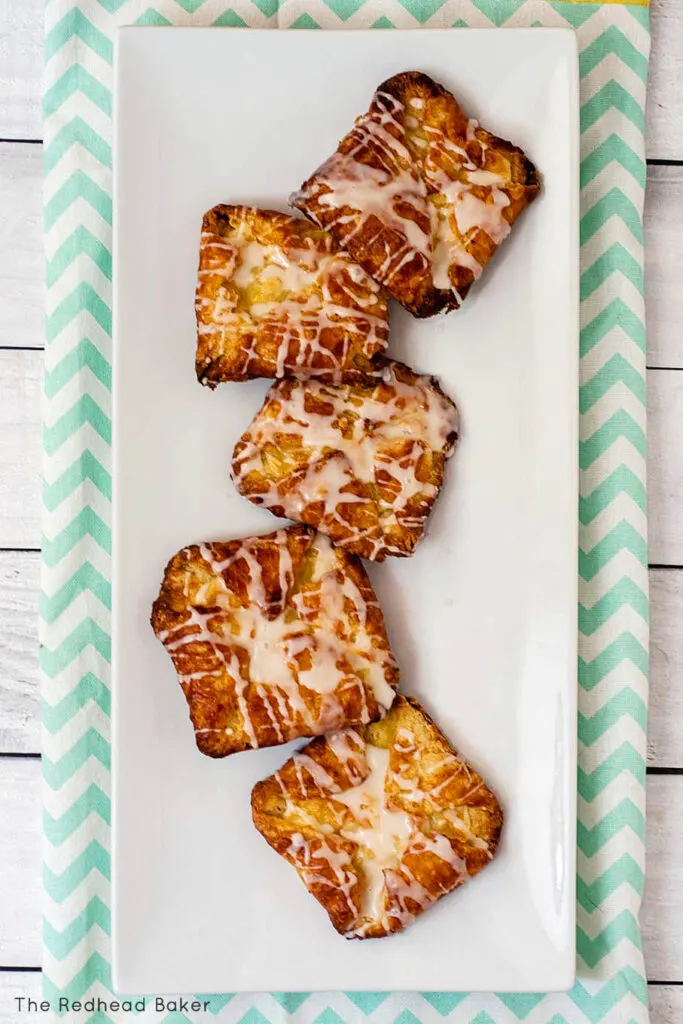 Five cheese danish on a white serving tray