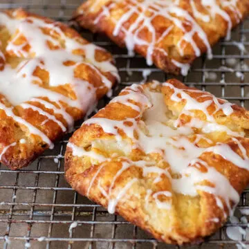 Three cheese danish on a cooling rack