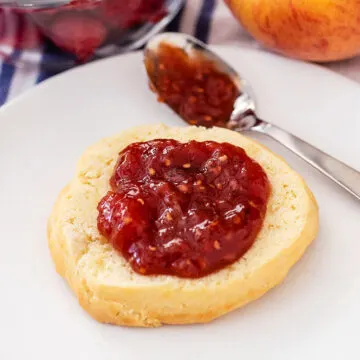 Half a shortcake spread with raspberry peach jam