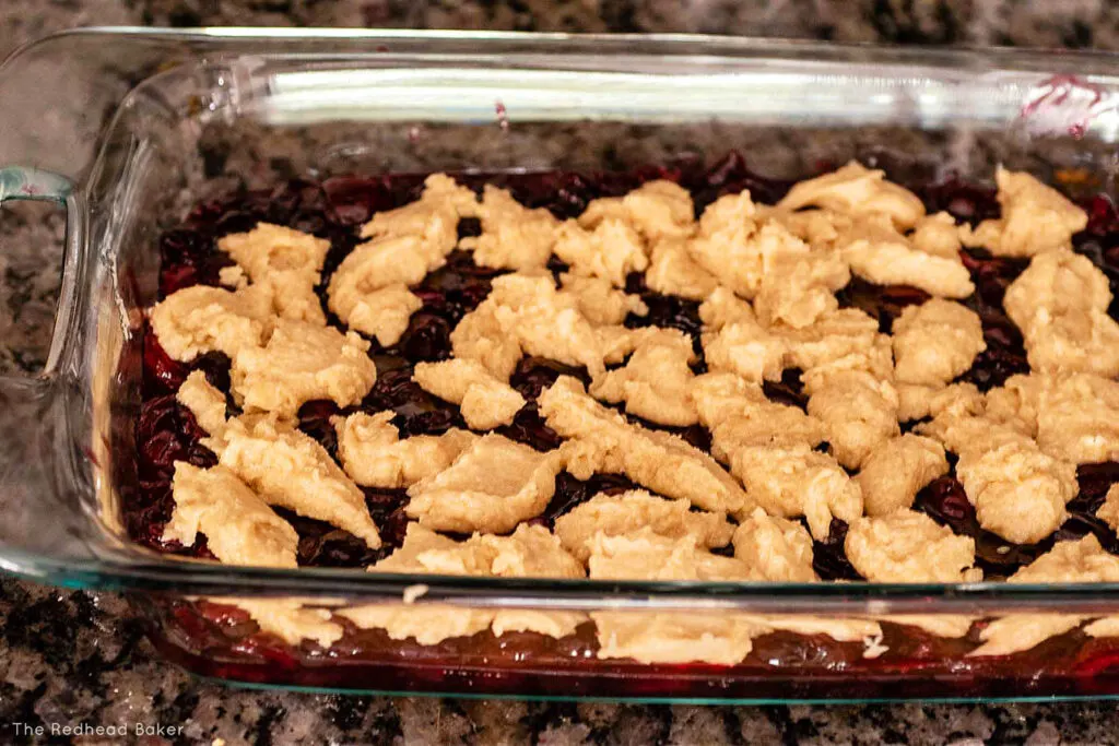 A baking dish of unbaked cherry cobbler