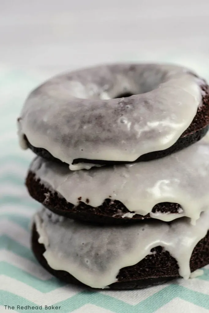A stack of baked chocolate donuts