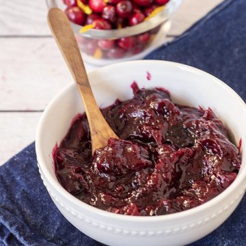 A white bowl filled with cherry cranberry sauce