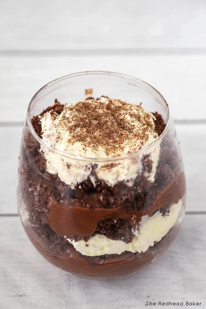 A slightly overhead view of a glass of chocolate trifle