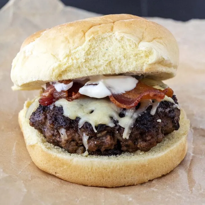 An Irish style burger on a crumpled piece of parchment paper
