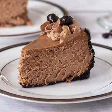 A slice of mocha cheesecake on a white plate