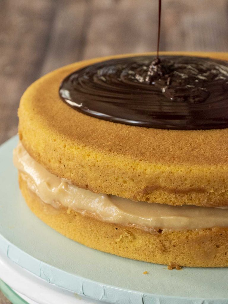 Pouring on the chocolate glaze.