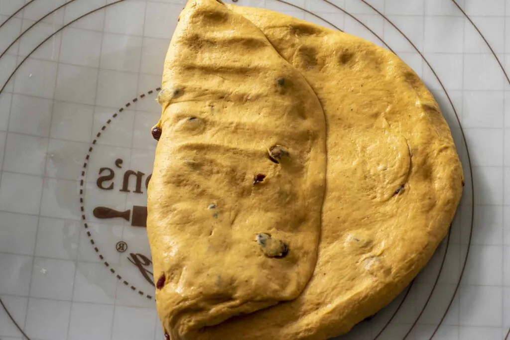 Step 2 of shaping: Folding over a third of the dough.