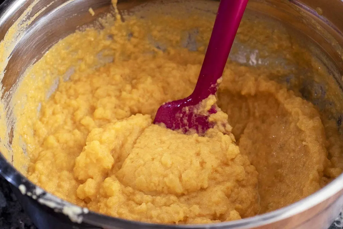 A bowl of just-mixed pumpkin mashed potatoes.