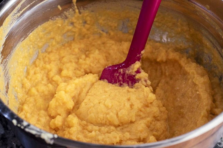 A bowl of just-mixed pumpkin mashed potatoes.