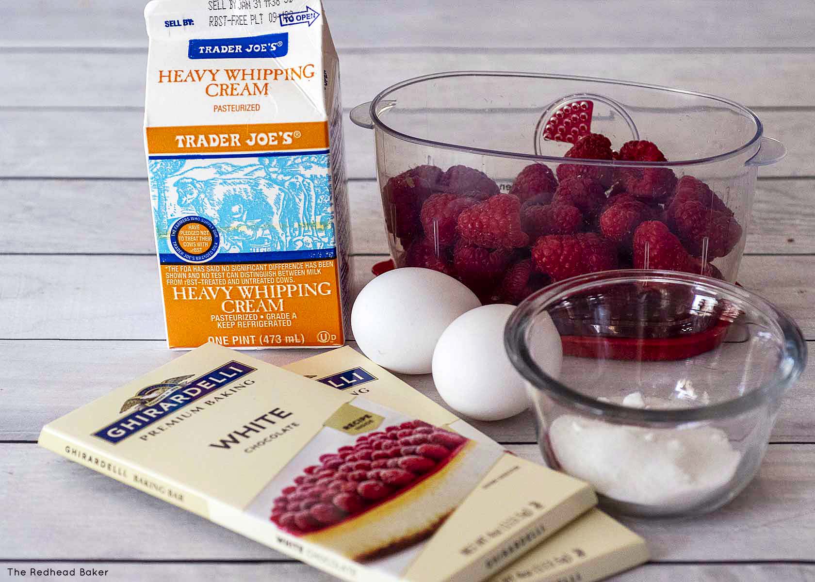 Ingredients for white chocolate mousse: cream, raspberries, sugar, eggs and white chocolate.