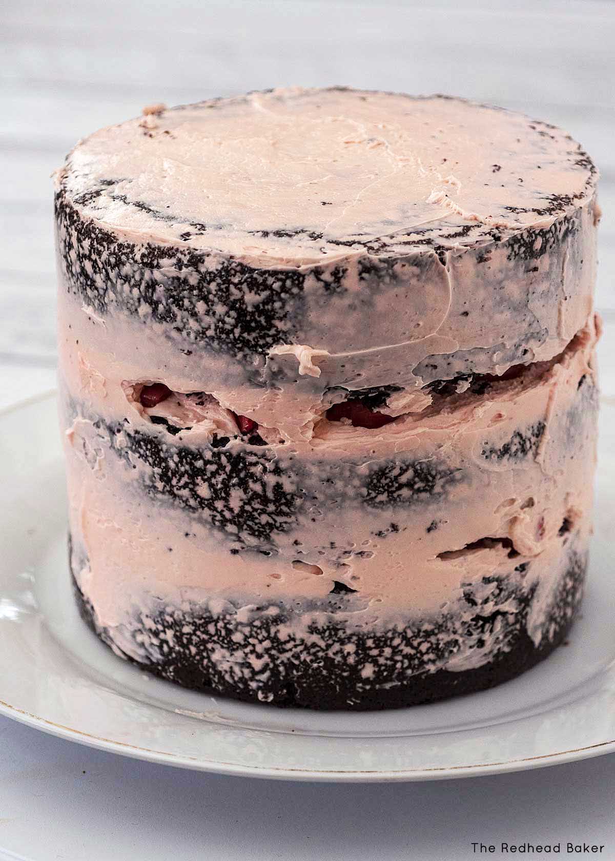 A three-layer cake with a crumb coat.