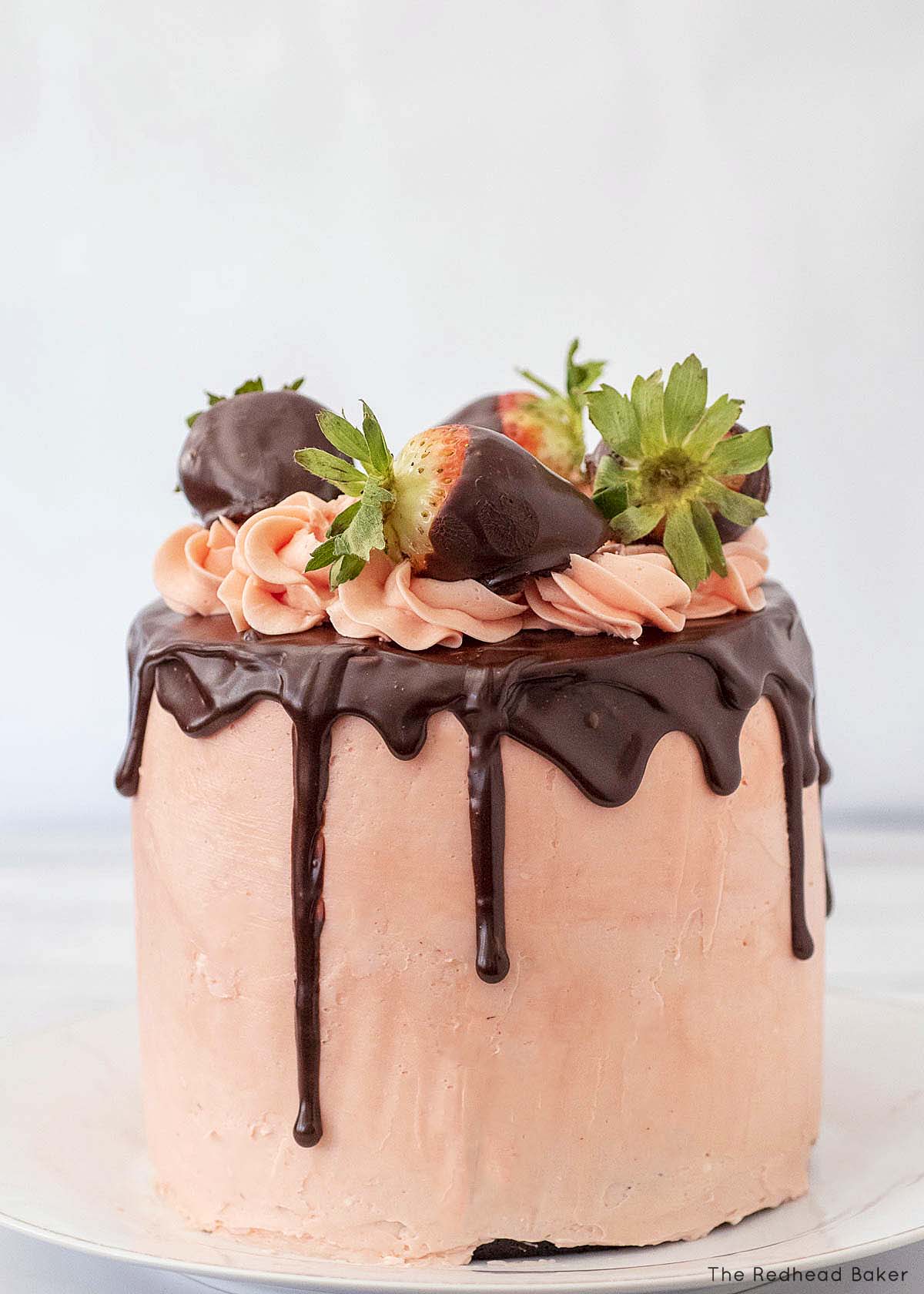 A whole 6-inch chocolate-covered strawberry layer cake.