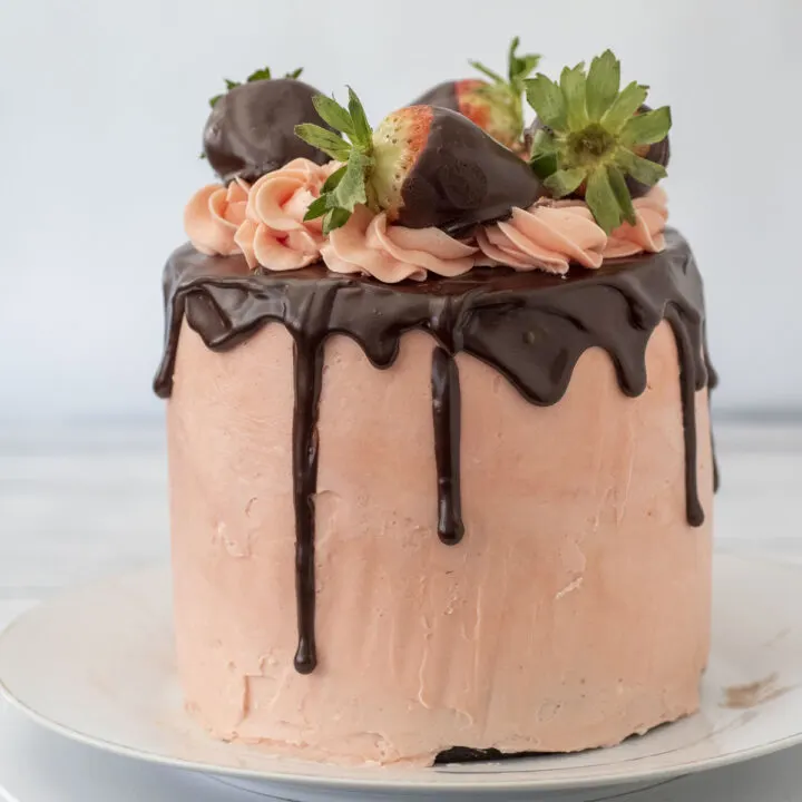 A chocolate-covered strawberry chocolate layer cake.