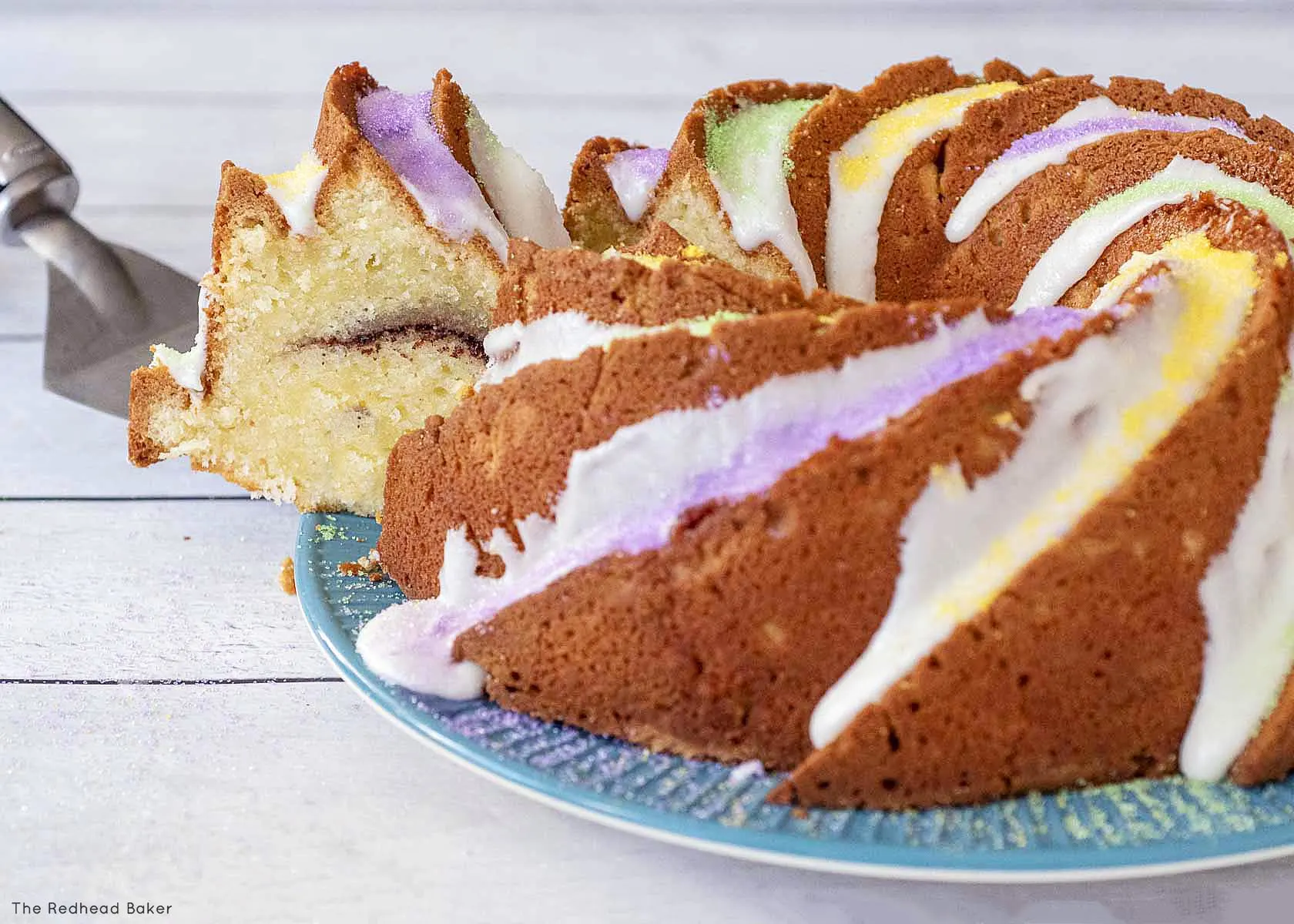 A slice being pulled away from the rest of the cake.