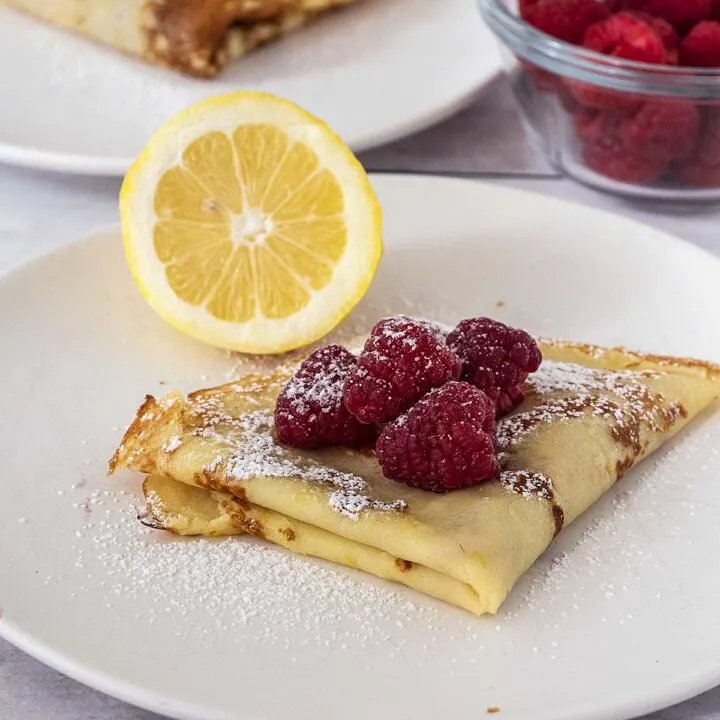 Lemon crepes with fresh raspberries.