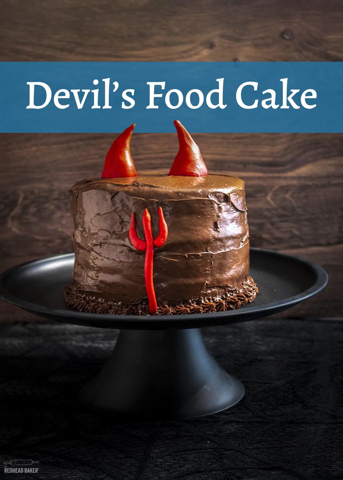 A devils food cake on a black cake stand.