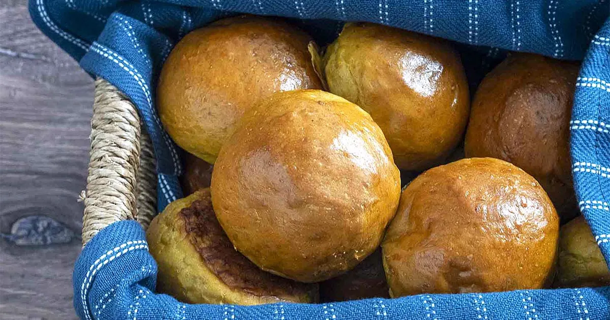 A basket of pumpkin dinner rolls.